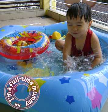 Ben playing in his water pool